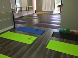 New Forward Motion Yoga studio space with mats laid out.