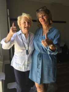 Photo of instructors Helen and Marg giving the new Forward Motion Yoga studio a thumbs up.