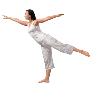 Woman standing on one foot with her arms extended doing yoga.